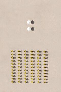 Indonesia, Bali, Aerial view of arrangement of potted palm trees and two beach umbrellas on&Ocirc;&oslash;&Omega;Nusa&Ocirc;&oslash;&Omega;Dua&Ocirc;&oslash;&Omega;beach