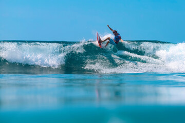 Surfer on a wave, Bali island,Indonesia