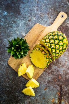 Chopped pineapple on chopping board