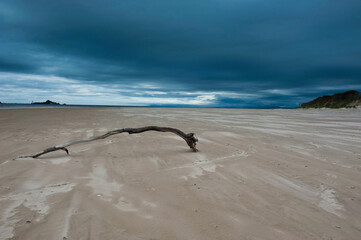 Bad weather on a lonely beach in Strahan, Tasmania, Australia