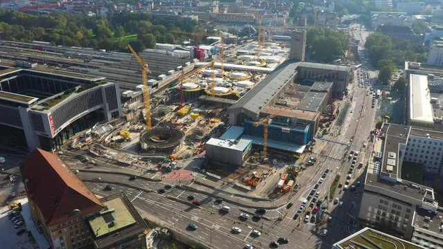 Aerial of huge railroads, intersection and construction site of main train station Stuttgart S21 with cranes and construction worker in Stuttgart, Germany.