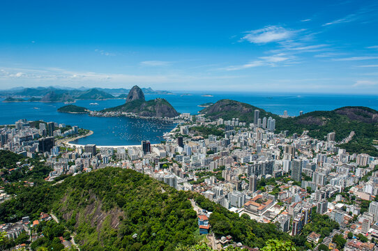 Outlook from the Christ the Redeemer statue over Rio de Janeiro with Sugarloaf Mountain, Brazil
