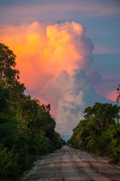 Beautiful illuminated cloud above a dirt track, Pantanal, Brazil