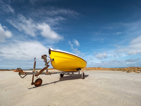 France, Bretagne, Cote de Granit Rose, boat trailer and yellow boat