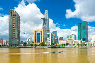 Fototapeta na wymiar Skyscrapers along river with architecture office towers, hotels, center cultural and commercial development country most in Ho Chi Minh city, Vietnam