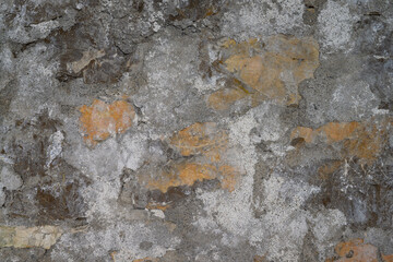 Fragment of an ancient wall. close-up. Block masonry with remnants of old plaster in the abandoned castle of the Prince of Oldenburg in Gagra (Abkhazia). Gray-white shades 