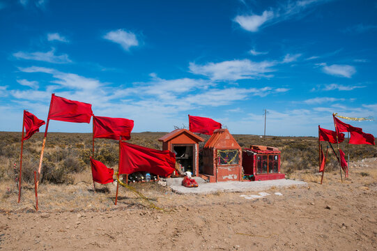 Red flags and a memorial, Valdes Peninsula, Argentina, South America
