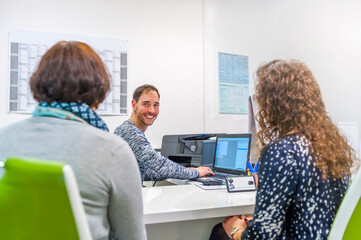 Two women with instructor in driving school