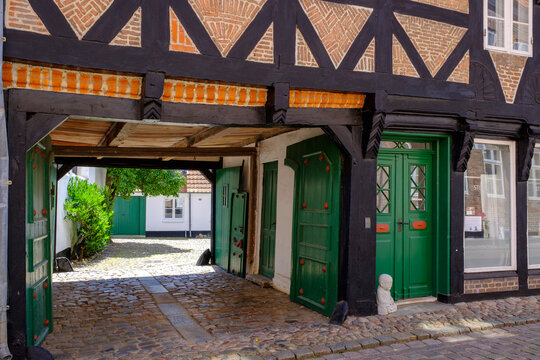 Denmark, Jutland, Ribe, Old town cobblestone alley