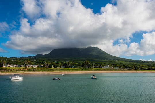 Scenic view of Nevis island against cloudy sky at Saint Kitts And Nevis, Caribbean