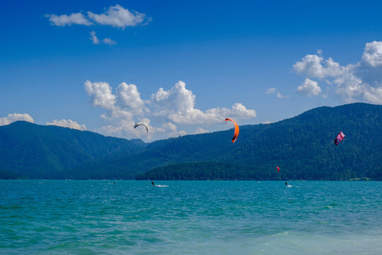 Germany, Upper Bavaria, Bavaria, Zwergern peninsula, Walchensee, Kite surfers on sunny day