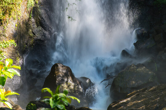 View of Trafalgar Falls splashing on rocks in Morne Trois Pitons National Park, Dominica