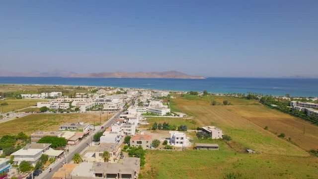 Aerial view over Tigaki town approaching beach, Kos, Greece
