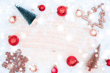 Table wood Christmas. Xmas board with old rustic wall, white frozen snow, golden balls and gift box. Winter wooden decoration background. Happy new year copy space.