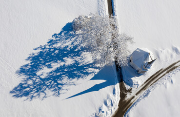 Germany, Upper Bavaria, Harmating, St. Leonhard's chapel in winter, drone view