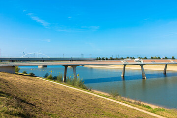 he new Lentloper bridge across the new channel of the river Waal with in the background the city of Nijmegen
seen from Oosterhoutsedijk. Gelderland Province, Netherlands