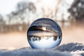 crystal ball on snow in the morning, fog