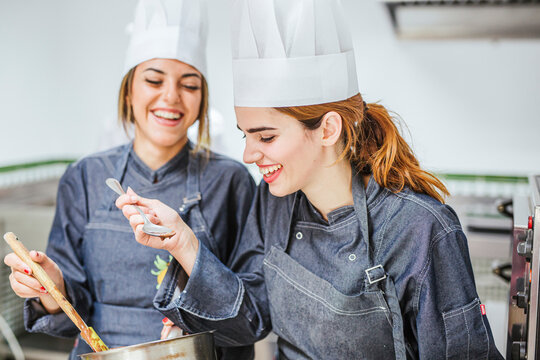 Junior chefs tasting chocolate sauce