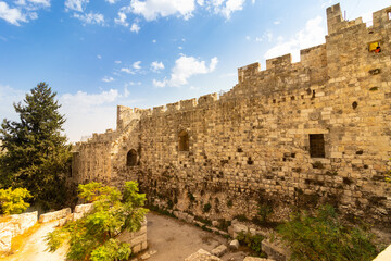 Fototapeta na wymiar jerusalem-israel. 13-10-2021. The famous and ancient walls around the Old City and the Jewish Quarter in Jerusalem, against a background of blue skies