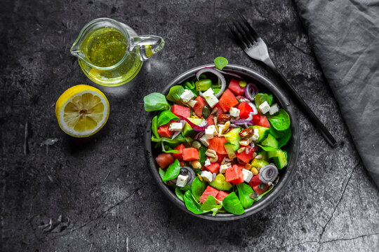 Lamb's lettuce with watermelon, feta, cucumber, red onion and nut