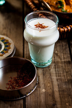 Glass of sweet Lassi with rosewater and saffron