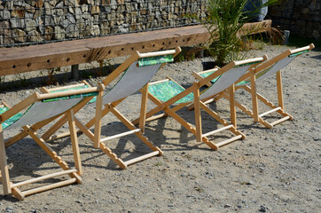 benches and seats, beach-type fabric chairs. tables where it is possible to have coffee on the sun....
