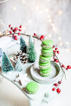 Stack of green macaroons and Christmas decorations