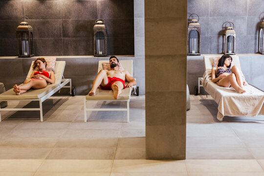 Women and man relaxing in a spa