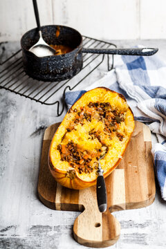 Baked spaghetti squash with vegan bolognese sauce made from lentils, leeks, and carrots