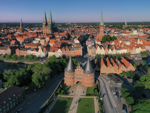 Germany, Schleswig-Holstein, Lubeck, Aerial view of Holsten Gate at dusk