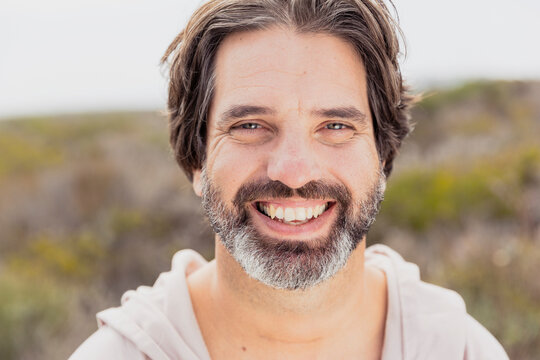 Portrait of happy bearded man