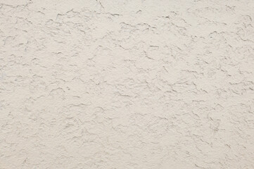 Asian modern plastered wall texture background. Luxury plastered wall with beautiful shadows caused by unevenness.