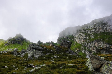 fog over the peaks from the mountains while hiking