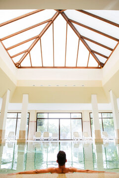 Man relaxing in swimming pool of a spa