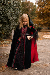 a girl in a witch costume for Halloween depicts fear and horror