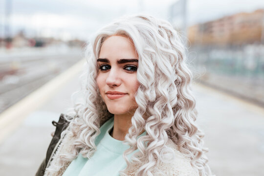 Portrait of smiling young woman on platform