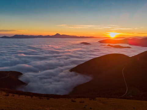 Italy, Marche, Apennines, Mount San Vicino at sunrise seen from mount Cucco