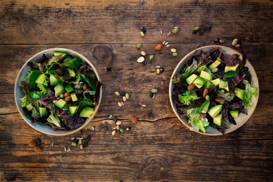 Various leaf salad with avocado, roasted seeds, almonds and soy beans