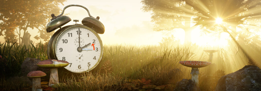 Fall Back Time. Return to wintertime. Daylight Saving Time concept. Alarm clock in Autumn landscape with sunset or sunrise in the background. 3D rendering.