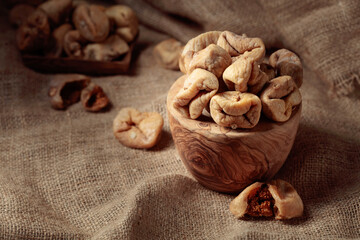 Dried figs in an old woodew dish.