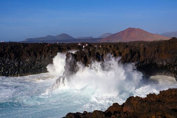 Breaking waves at rocky coast, Los Hervideros, Lanzarote, Spain