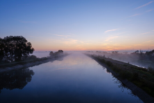 Germany, Bavaria, Isar canal at Ismaning reservoir, near Pliening, dawn