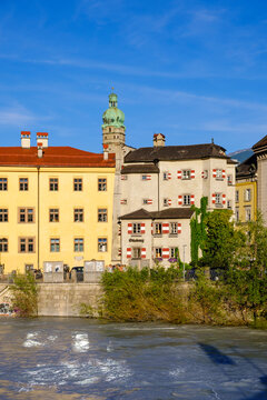 Exterior of inn and Stadtturm against blue sky at Innsbruck, Austria
