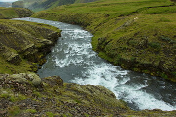 Naklejka na ściany i meble Waterfall Fosstorfufoss over Skogafoss on Iceland, Europe 