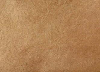 Background with beige textured paper with copy space