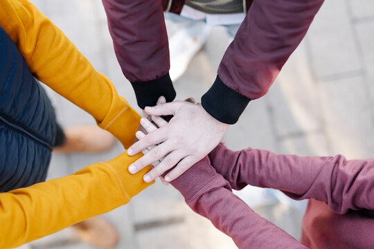 Close-up of friends stacking their hands