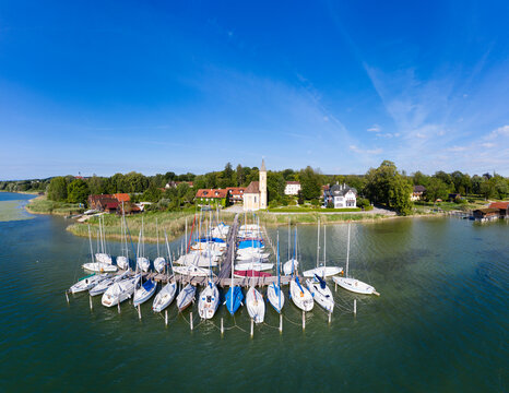 Boats moored at jetty at Lake Ammersee in Upper Bavaria, Germany