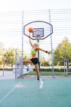 Blonde Woman Playing Basketball, Dunking