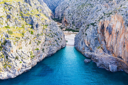 Spain, Balearic Islands, Sa Calobra, Drone view of seaside end of Torrent de Pareis gorge