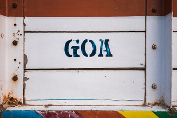 Text on side of white weathered truck